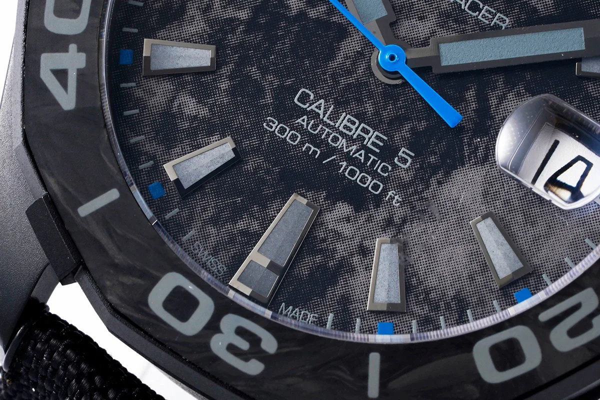 Aquaracer Calibre 5 Carbon Dial with Blue Tachymeter